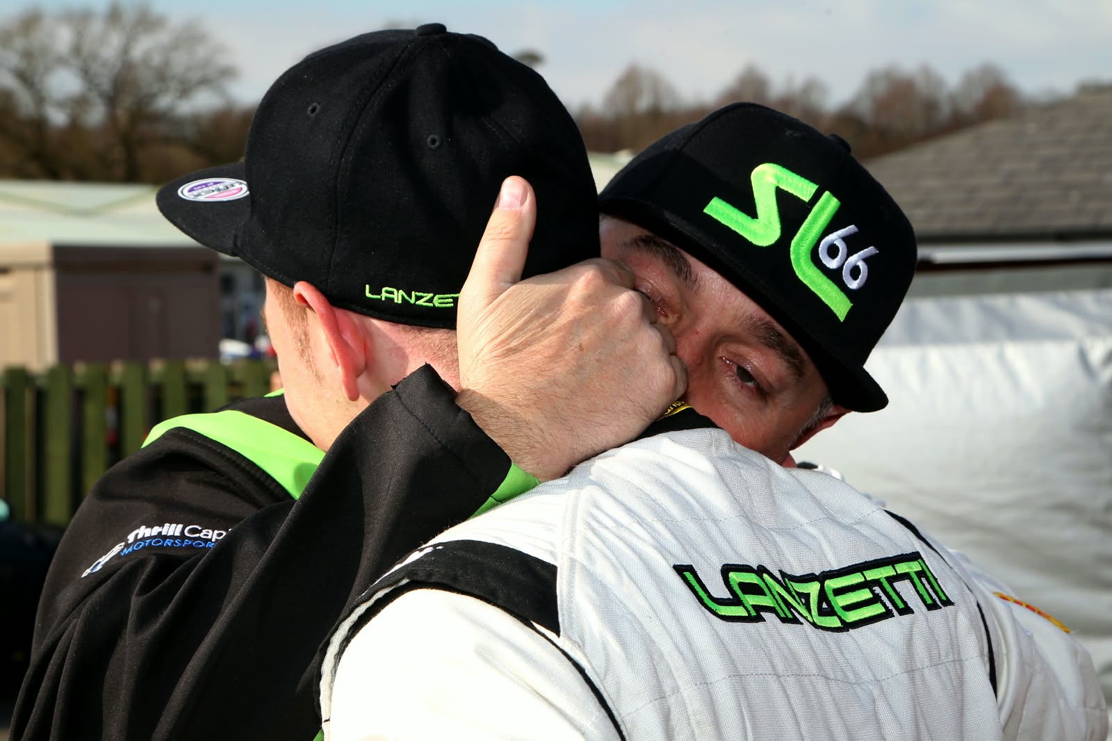 Sebastian and Matteo Lanzetti embracing at the track